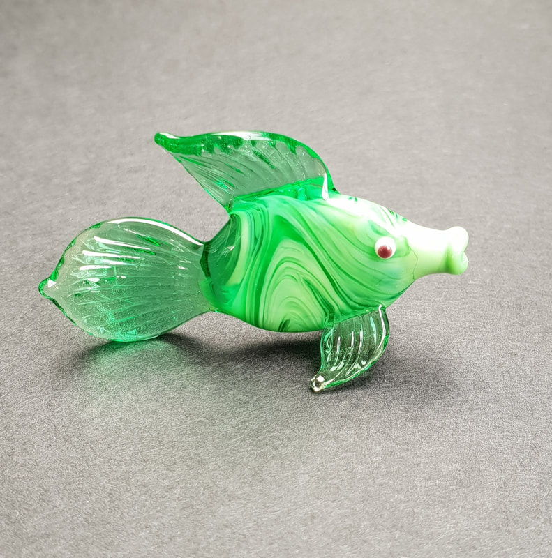 Green glass fish figurine