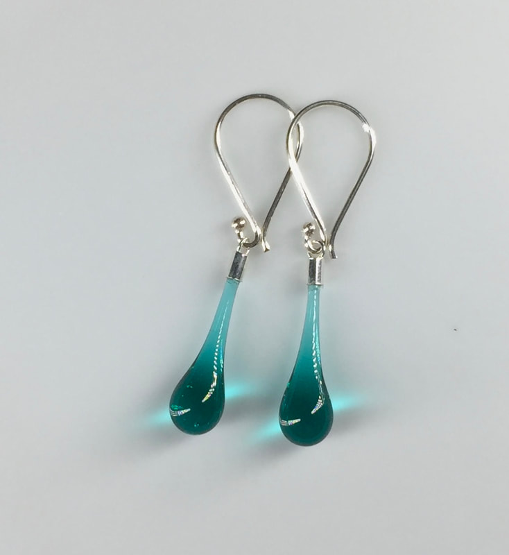 Transparent teal drop earrings with sterling silver findings.