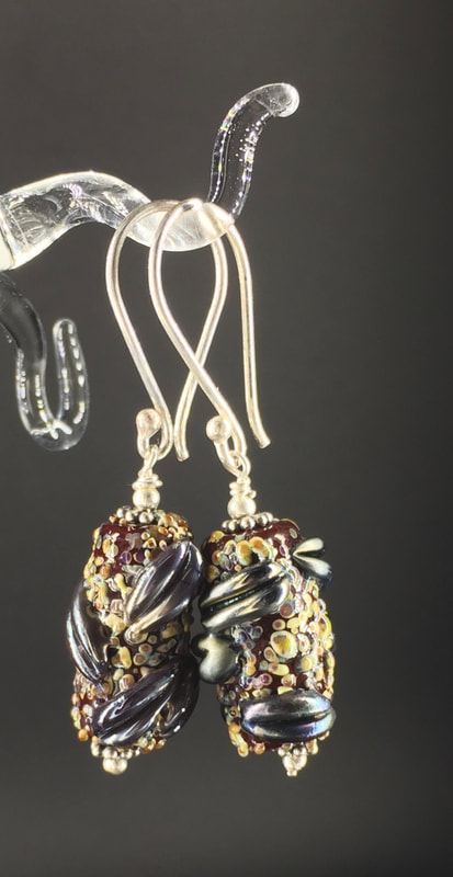 Glass banksia pod earrings with gunmetal lips, sterling silver findings.