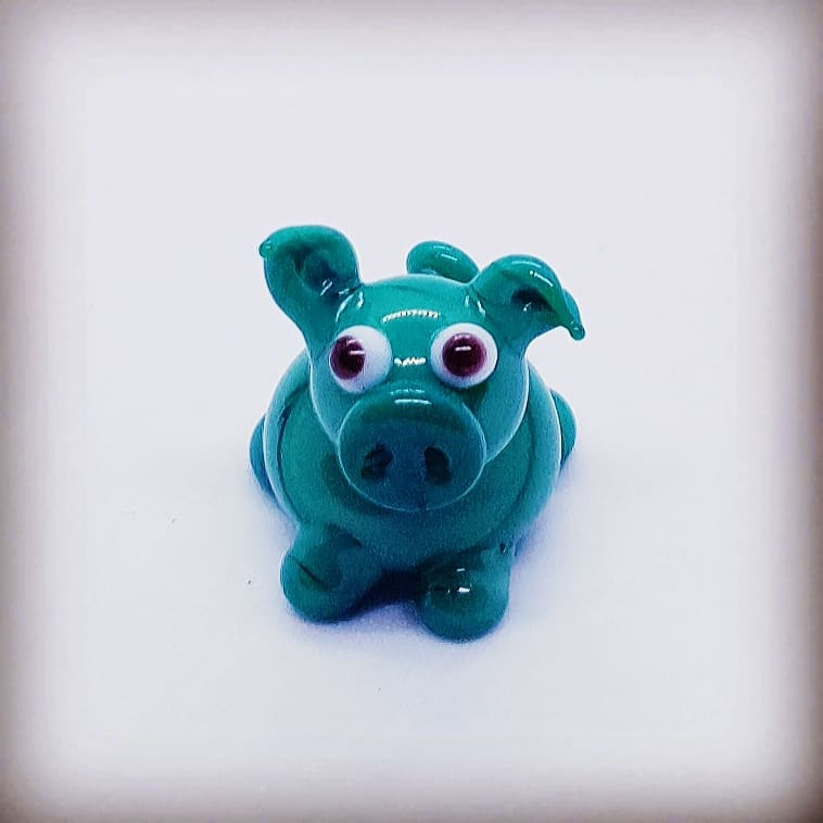 Miniature green glass pig